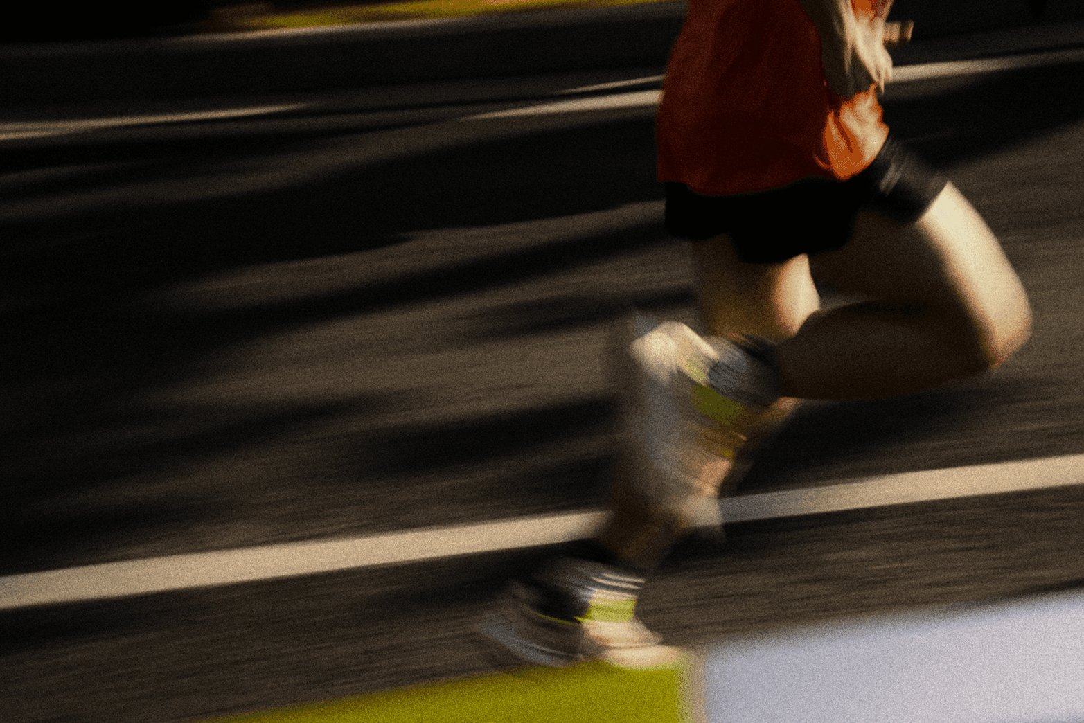 Runner in motion on a road with strong motion blur effect